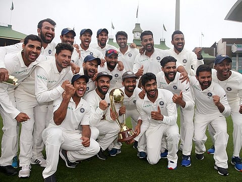 India's cricket team celebrate with the Border-Gavaskar Trophy as they celebrate their series win over Australia in Sydney, Monday, January 7, 2019.