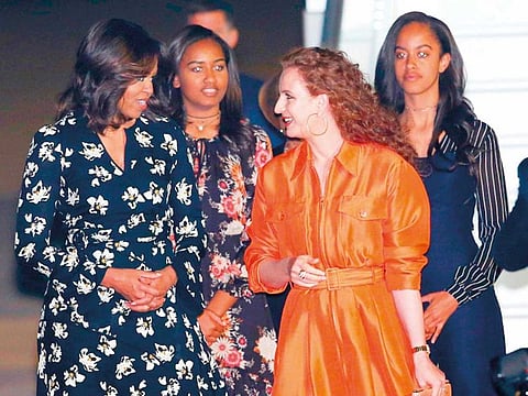 Former US First Lady Michelle Obama (left).