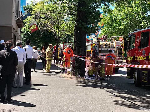 Hazmat and fire crews work outside the Indian and French Consulate in Melbourne, Australia. At least seven international consulates were evacuated after reports that multiple suspicious packages had been sent to them.