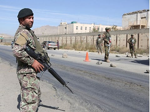 Afghan National Army soldiers stand guard at a checkpoint in Kabul, Afghanistan, in October 2018.