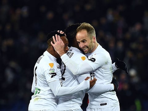 Guingamp’s players celebrate after winning the French League Cup quarter-final against Paris Saint-Germain.