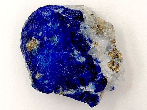 This undated photo released by the Max Planck Institute for the Science of Human History in Jena, Germany, shows a piece of lapis lazuli