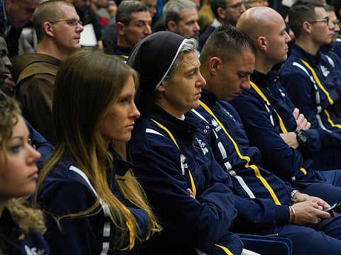 Sister Marie Theo, third from left, sits among other athletes of the Athletica Vaticana Vatican sports team, as they attend a press conference, at the Vatican
