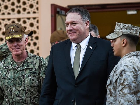 U.S. Secretary of State Mike Pompeo, center walks with Vice Adm. James Malloy, commander of the U.S. Naval Forces Central Command/5th Fleet, after a tour of the U.S. Naval Forces Central Command center in Manama, Bahrain, Friday, Jan. 11, 2019.