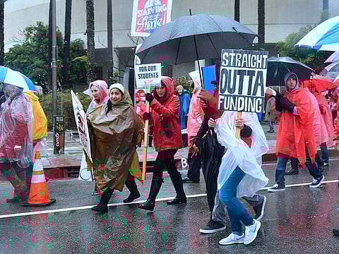 Thousands of teachers march in the rain through Los Angeles, California on January 14, 2019.