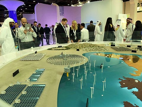 The visitors and delegates check out at Solar project by Masdar City at their pavilion during the Abu Dhabi Sustainability Week at Adnec.