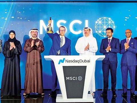DIFC governor Eisa Kazim watches as Robert Ansari, MSCI’s executive director and head of the Middle East, rings the market-opening bell at Nasdaq Dubai MarketSite to celebrate the start of trading.