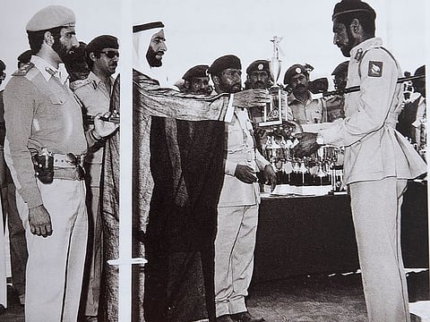 With Sheikh Zayed Bin Sultan honouring one of the armed forces group.