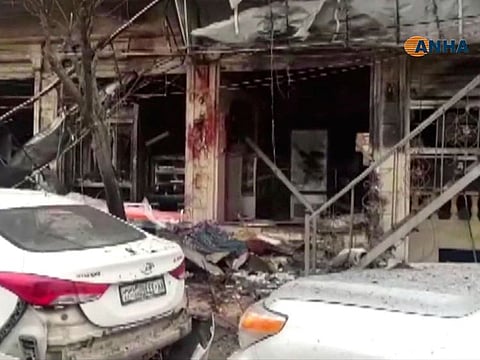 This frame grab from video provided by Hawar News, ANHA, the news agency for the semi-autonomous Kurdish areas in Syria, shows a damaged restaurant where an explosion occurred, in Manbij, Syria, Wednesday, Jan. 16, 2019.