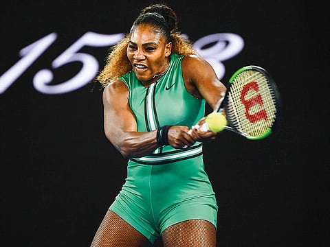 Serena Williams hits a return against Eugenie Bouchard during their women’s singles in the Australian Open in Melbourne yesterday. The American eased to a 6-2, 6-2 victory.