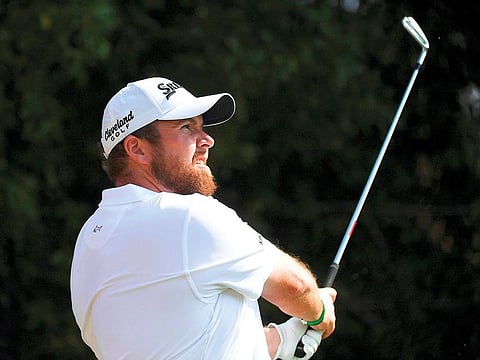 Shane Lowry watches the ball after a tee-off at the fourth hole in round two of the Abu Dhabi Championship.