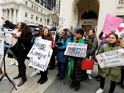 Sonja Spoo (left), associate campaign director of Ultra Violet, leads chants during an R Kelly protest outside Sony headquarters in New York on January 16.