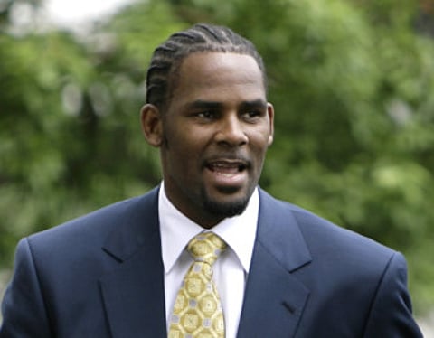 This June 13, 2008 file photo shows R&B singer R. Kelly arriving at 3the Cook County Criminal Court Building in Chicago.