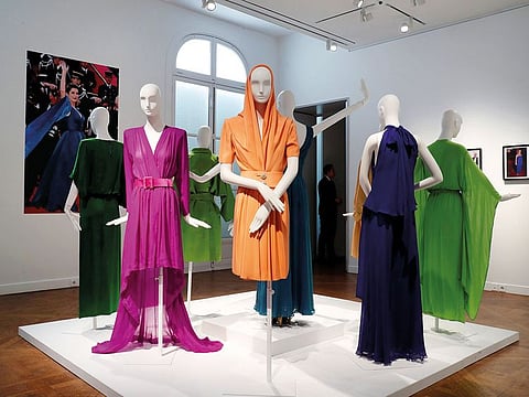 Dresses from French actress Catherine Deneuve's wardrobe and designed by French designer Yves Saint Laurent are displayed in the showroom of Christie's auction house before the collection sale in Paris