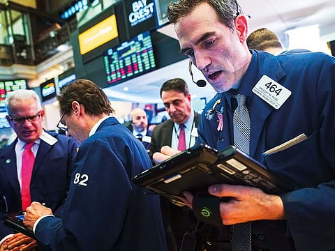 Traders at the New York Stock Exchange. The Dow index rose 1.38 per cent to 24,706.35 on Friday, gaining for the eight session out of the past 10 sessions.