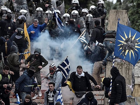 Protesters clash with riot police in Athens on January 20, 2019 during a demonstration against the agreement with Skopje to rename neighbouring country Macedonia as the Republic of North Macedonia.