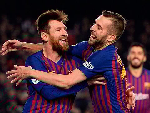 Barcelona's Lionel Messi (L) celebrates with defender Jordi Alba after scoring during the Spanish League football match between Barcelona and Leganes at the Camp Nou stadium in Barcelona on January 20, 2019.