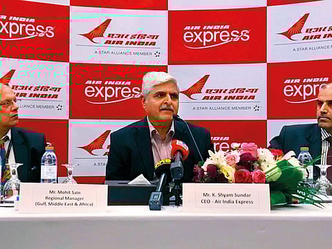 K. Shyam Sundar (centre) addresses media in Dubai with Mohit Sain (left) and V.C. Venugopal.