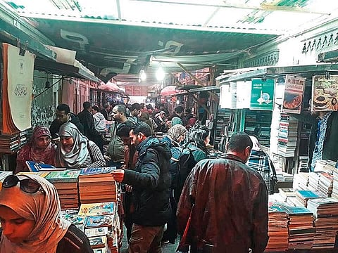 People hunt for bargains at the Sur Al Azbakia book fair.