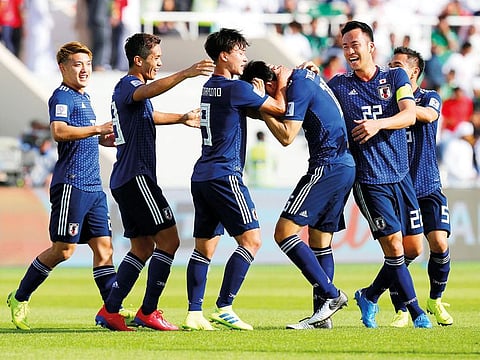 Tomiyasu Takehiro celebrates after scoring the eventual winner against three-time champions Saudi Arabia in the last 16 stage of the Asian Cup at Sharjah on Monday.