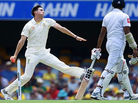 Australia's Jhye Richardson (L) bowls during the first day of the day-night Test cricket match between Australia and Sri Lanka at the Gabba in Brisbane on January 24, 2019.