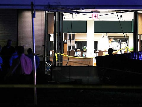 The SunTrust Bank branch is seen as law enforcement officials investigate the scene where five people were killed on January 23, 2019 in Sebring, Florida.