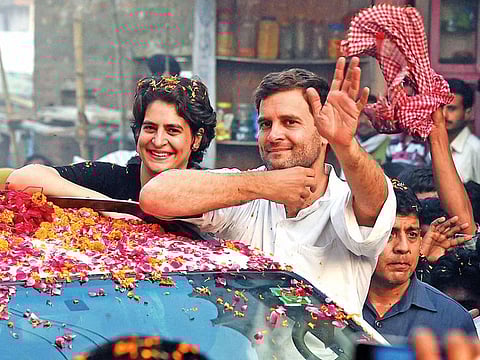 In this May 4, 2014 file photo Priyanka Vadra is seen with her brother and Congress President Rahul Gandhi during a road show in Amethi.