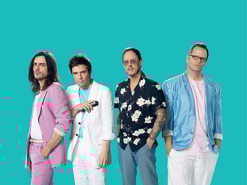 Brian Bell, Rivers Cuomo, Scott Shriner and Patrick Wilson of Weezer.