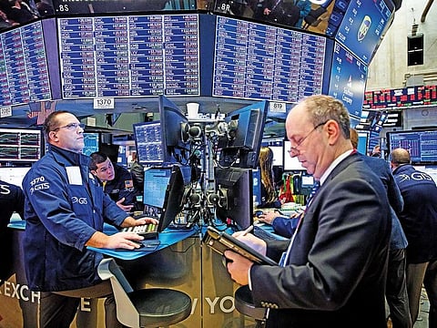 Traders at the New York Stock Exchange. S&P 500 earnings are now expected to grow by 5.9 per cent in 2019.