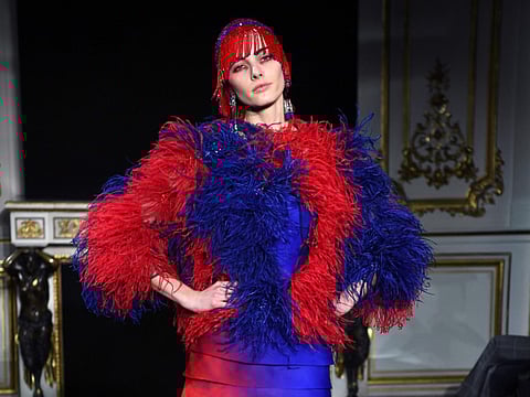 A model presents a creation by Giorgio Armani