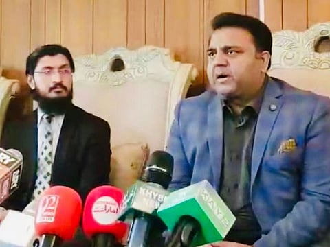 Fawad Chaudhry, Minister of Information of Pakistan (right).