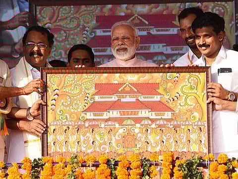 India's Prime Minister Narendra Modi being presented a memento during a meeting at Thrissur, Kerala, on Sunday, January 27, 2019.