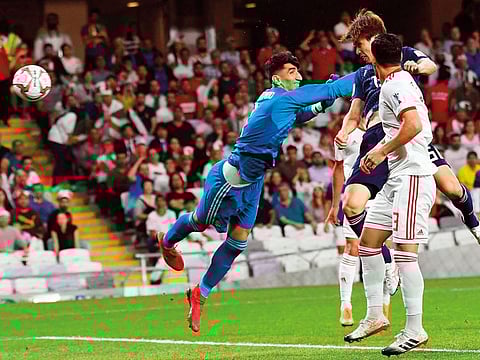 Japan's forward Yuya Osako (second right) scores during their 2019 AFC Asian Cup semi-final against Iran in Abu Dhabi during the 2019 edition.