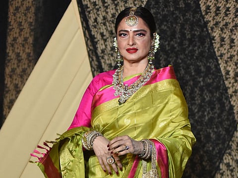 Indian Bollywood actress Rekha poses for a picture during the wedding reception of film producer Mukesh Bhatt's daughter Sakshi Bhatt, in Mumbai late on January 25, 2019. / AFP / Sujit Jaiswal