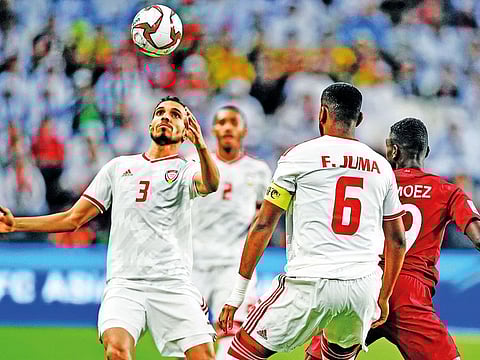 UAE players in action during the AFC Asian Cup semi-final against Qatar in Abu Dhabi.