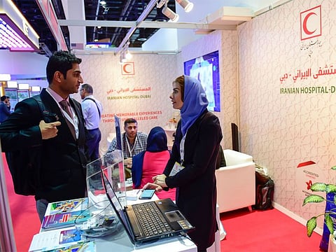 Visitors at Iranian Hospital Dubai stand at the Arab Health 2019 at Dubai World Trade Centre