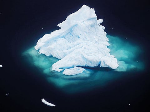 An iceberg floats in a fjord near the town of Tasiilaq, Greenland, on June 24, 2018