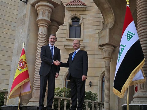 Iraqi President Barham Saleh (R) receives the King of Spain Felipe VI in the capital Baghdad on January 30, 2019. King Felipe visited special forces helping Iraq fight jihadists, during the first trip by a Spanish monarch to the war-ravaged country in four decades, a diplomat said.