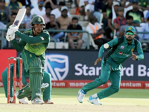 South Africa's batsman Quinton de Kock, left, at the wicket in front of Pakistan's Babar Azam, right, during their ODI cricket match at the Newland's Cricket Ground in Cape Town, South Africa, Wednesday, January 30, 2019.