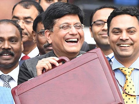 Indian Finance Minister Piyush Goyal (C) leaves the Finance ministry to table the budget in Parliament in New Delhi on February 1, 2019