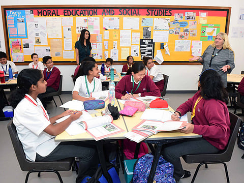Glenda Clark (right) conducts a Moral Education class at The English College.