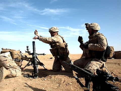 U.S. Marines prepare to fire on a Taliban position near Marja, Afghanistan, on Feb. 17, 2010