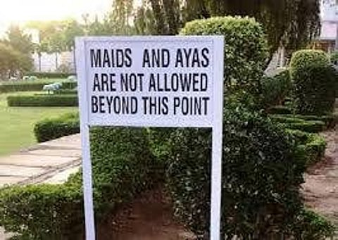 A signboard restricting domestic workers' entry to a club in Pakistan.