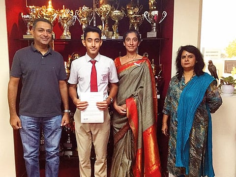 Varun Kumar with his parents and Ambika Gulati, Principal, The Millennium School (second from right).
