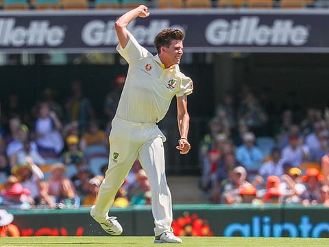 Australia's Jhye Richardson celebrates after dismissing Dinesh Chandimal of Sri Lanka during the day-night Test cricket match between Australia and Sri Lanka at the Gabba in Brisbane on January 24, 2019.