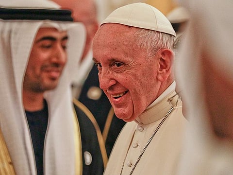 Pope Francis smiles upon his arrival at the Abu Dhabi airport, United Arab Emirates