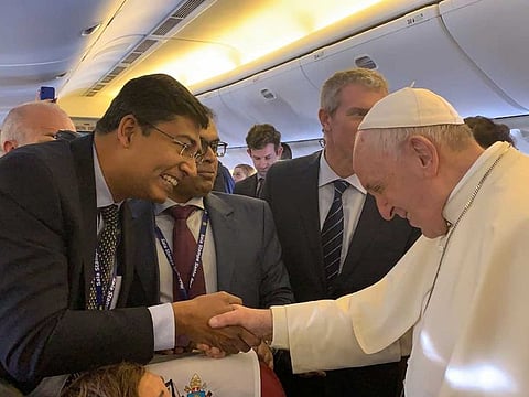 Alex Abraham greets the Pope on Alitalia flight bound to the UAE from Rome.