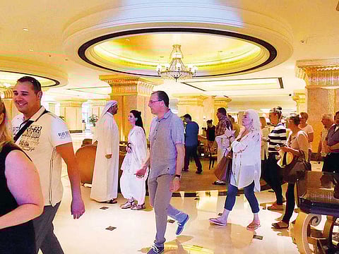 Tourists at the Emirates Palace Hotel in Abu Dhabi.