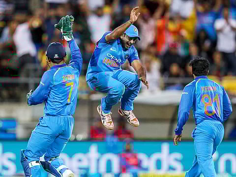 India's MS Dhoni, left, and Ambati Rayudu celebrate the wicket of New Zealand's James Neesham during their fifth one day international at Westpac Stadium in Wellington, New Zealand, Sunday, February 3, 2019.