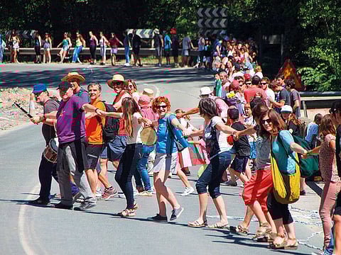 People join hands to form a 202 km long, according to organisers, human chain linking the cities of San Sebastian, Vitoria and Bilbao to call for a right to vote on Basque independence, near Vitoria, Spain